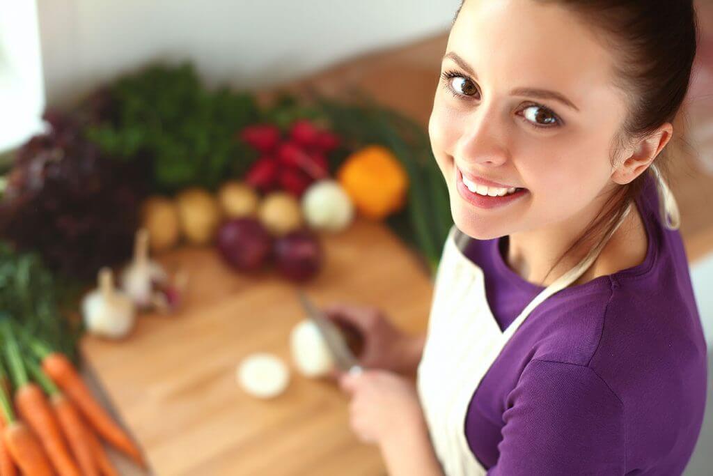 Woman Cooking Best Foods for Preventative General Dentistry