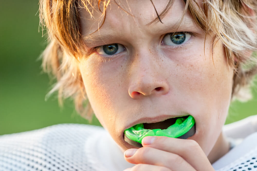 Child athlete with mouth guard