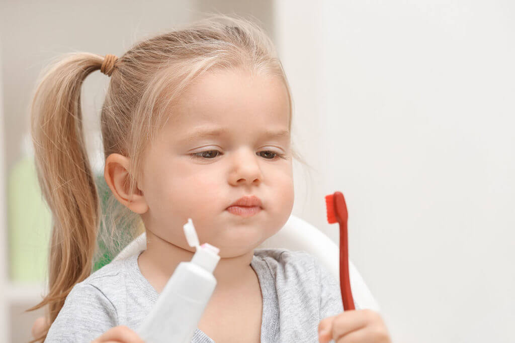 Little girl brushing teeth