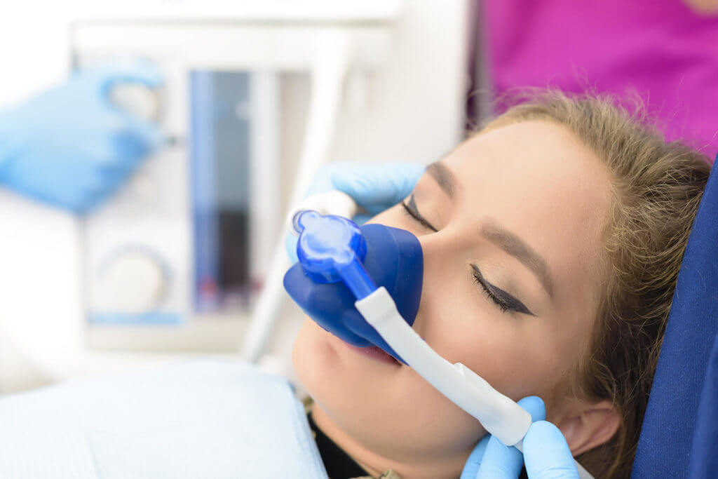 Woman receiving preparing for sedation dentistry