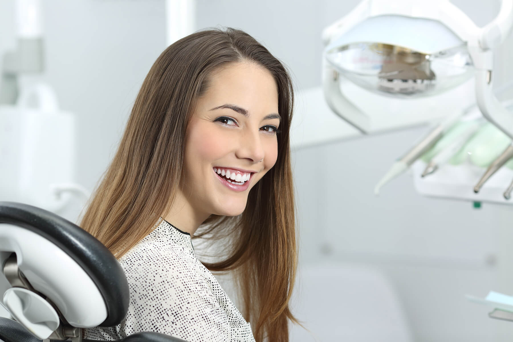 Dental patient showing off her smile