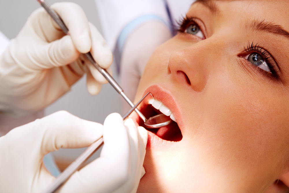 Close Up of a Female Patient Receivng Dental Treatment