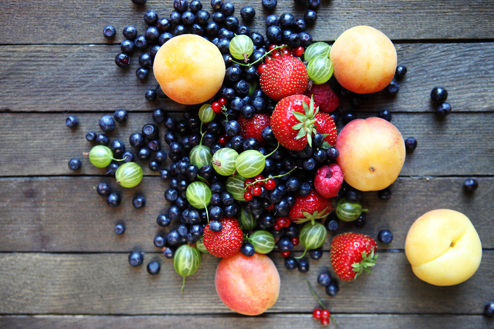 Fresh Fruit Against a Rustic Wood Background