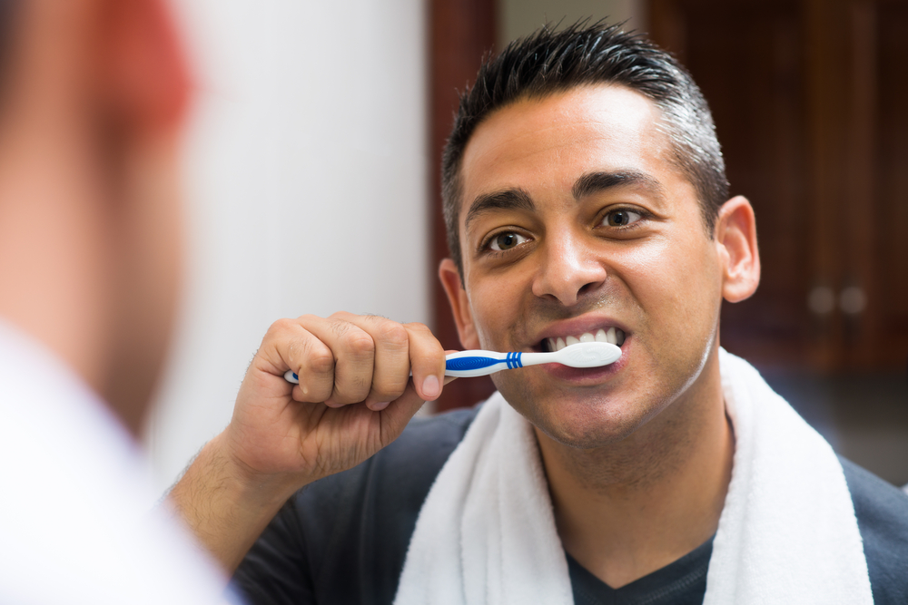 Middle-Aged Man Brushing Teeth