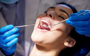 Dentist performs a comprehensive exam