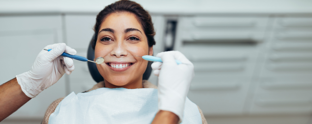 Woman Getting Her Teeth Cleaned  at the Dentist