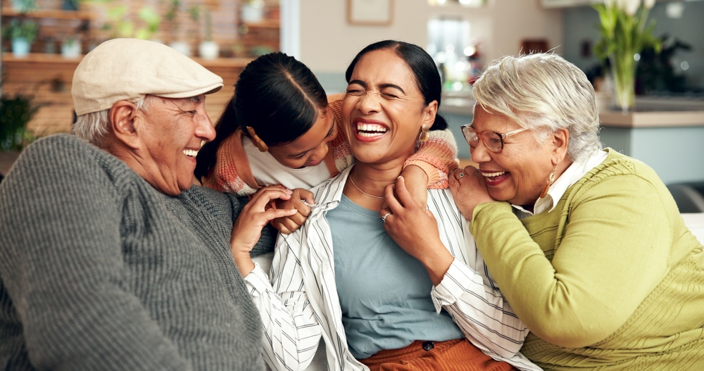 Happy Family Smiling on Couch